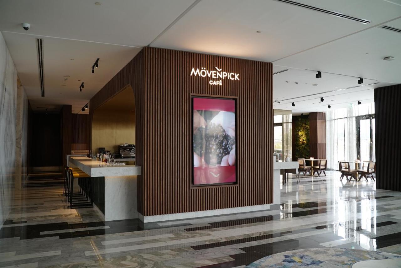 Movenpick Jumeirah Village Triangle Dubai Exteriör bild Mövenpick Café in the lobby of the Kempinski Hotel, Amman, Jordan