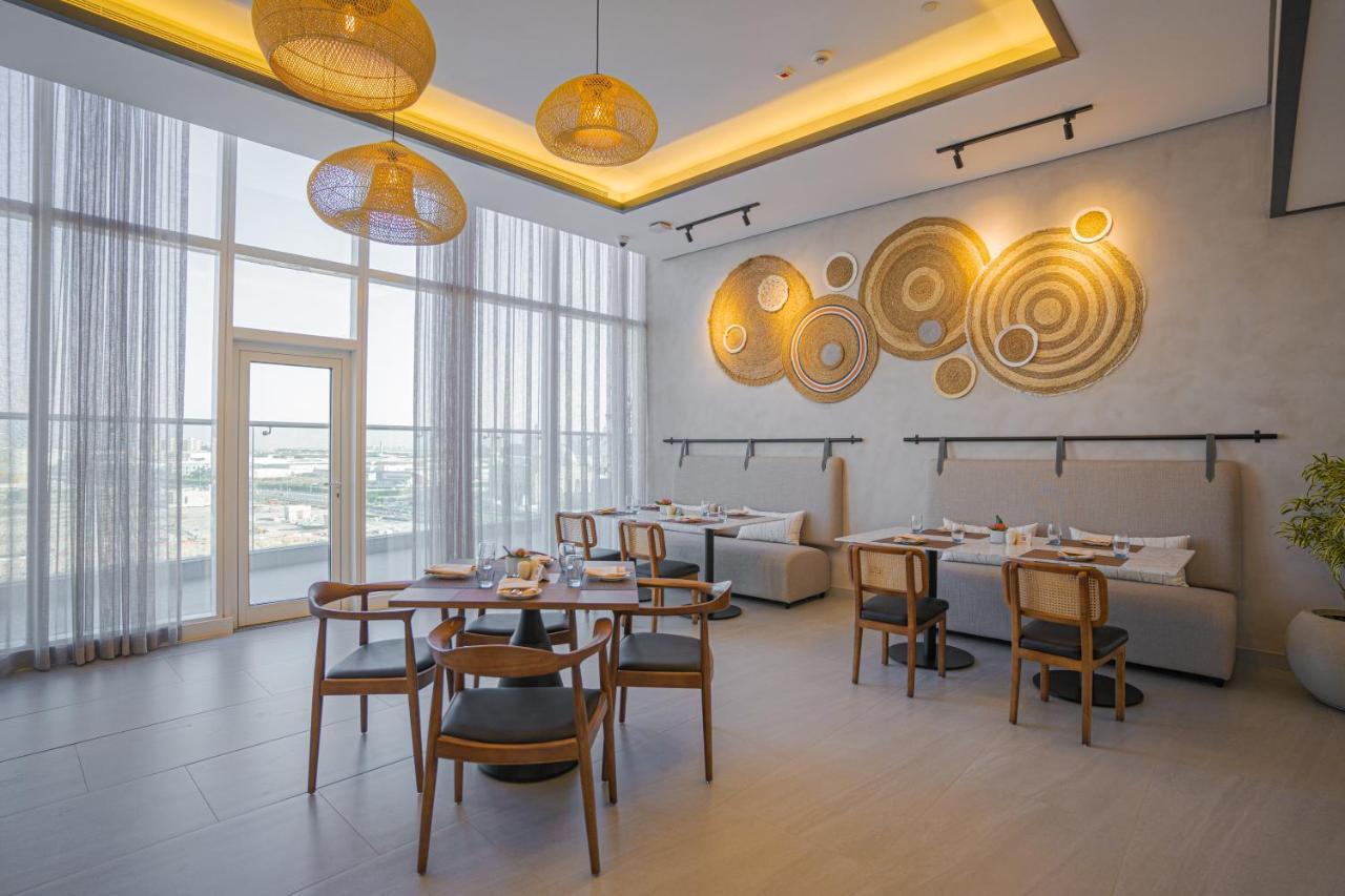 Movenpick Jumeirah Village Triangle Dubai Exteriör bild The restaurant