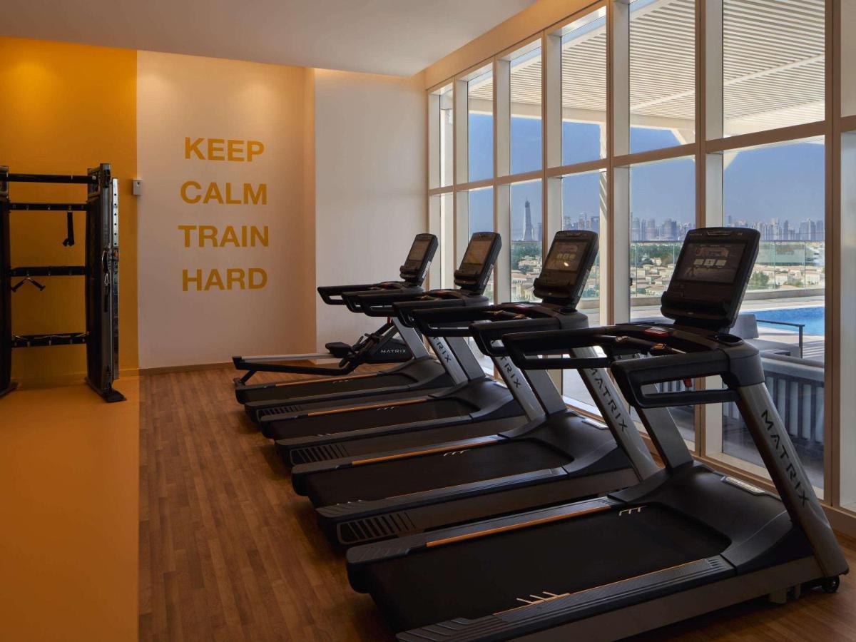 Movenpick Jumeirah Village Triangle Dubai Exteriör bild The gym at the hotel