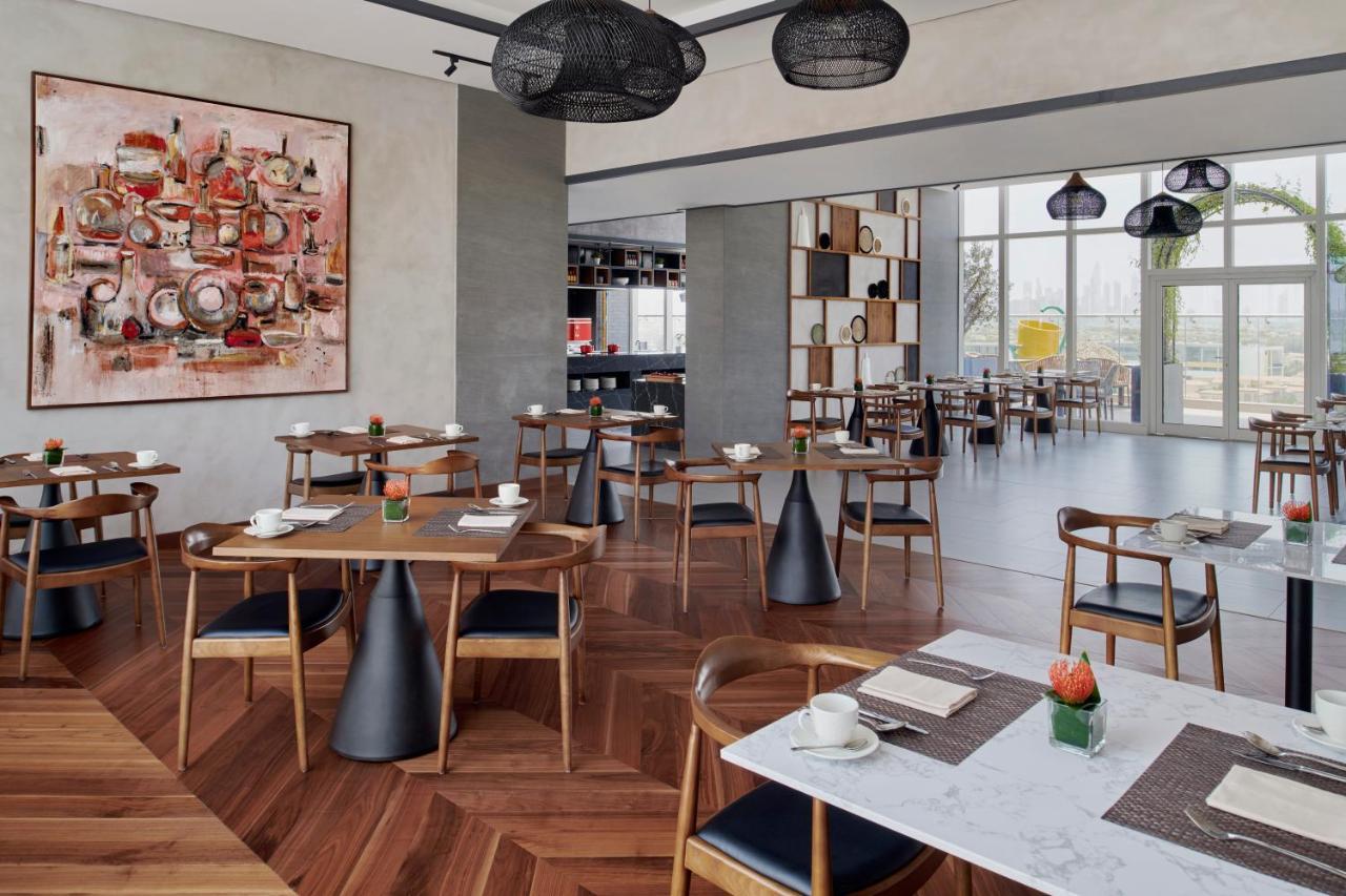 Movenpick Jumeirah Village Triangle Dubai Exteriör bild The restaurant